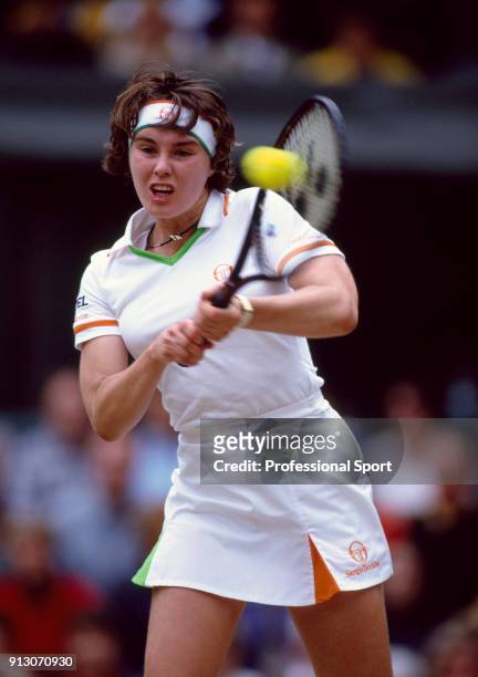 Martina Hingis of Switzerland in action during the Wimbledon Lawn Tennis Championships at the All England Lawn Tennis and Croquet Club, circa June,...