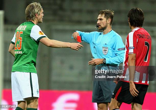 Peter Niemeyer of Bremen gets the yellow-red card from referee Alexandru Dan Tudor during the UEFA Europa League Group L match between SV Werder...