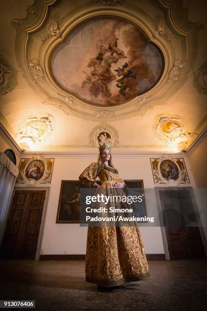 Model poses in Guarana room, that appears for the first time after the renewing, of Scuola Grande San Giovanni Evangelista, wearing a Venezia costume...