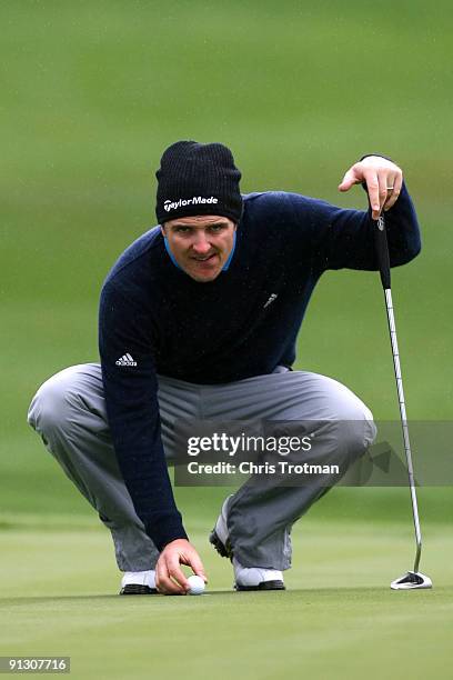 Justin Rose of England lines up a putt on the 17th hole during the first round of the 2009 Turning Stone Resort Championship at Atunyote Golf Club...