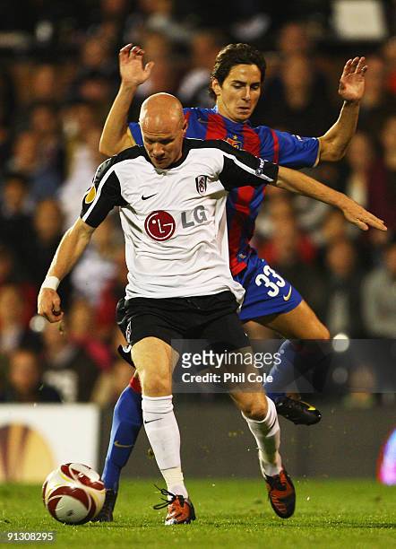 Andy Johnson of Fulham evades Serkan Sahin of FC Basel during the UEFA Europa League Group H match between Fulham and FC Basel at Craven Cottage on...