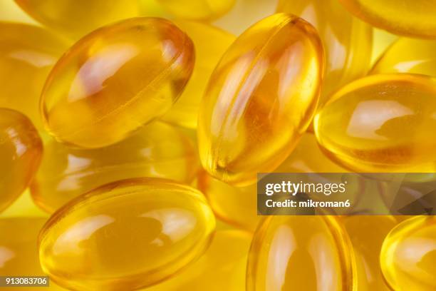 cod liver oil capsules. medical concept - std test stock pictures, royalty-free photos & images