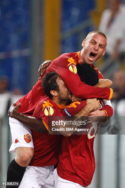 Stefano Okaka , Mirko Vucinic and Daniele De Rossi of AS Roma celebrate the opening goal during the UEFA Europa League Group E match between AS Roma...