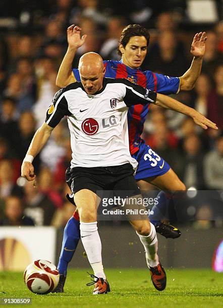 Andy Johnson of Fulham evades Serkan Sahin of FC Basel during the UEFA Europa League Group H match between Fulham and FC Basel at Craven Cottage on...