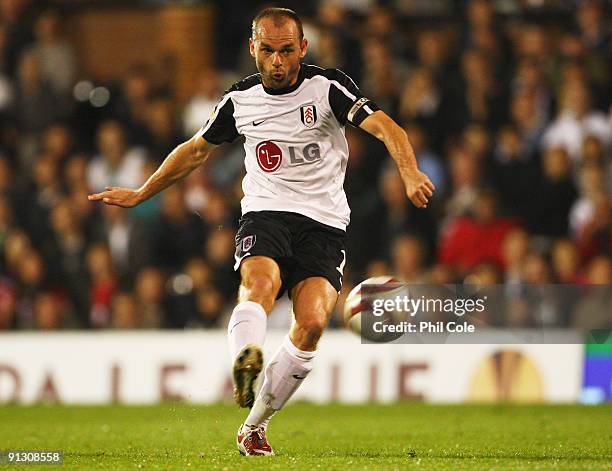 Danny Murphy of Fulham shoots from a free-kick during the UEFA Europa League Group H match between Fulham and FC Basel at Craven Cottage on October...