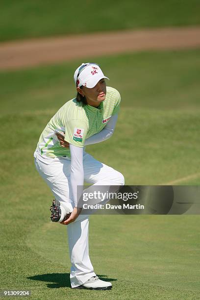 Na Yeon Choi of South Korea stretches on the ninth green after completing her first round play in the Navistar LPGA Classic at the Robert Trent Jones...