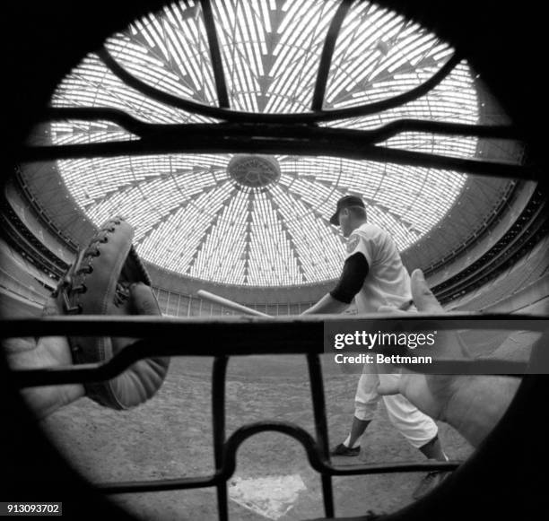 Lights in the dome of Houston's new indoor stadium shine high above the diamond as Astro infielder Rusty Staub gets ready to swing the bat in the...