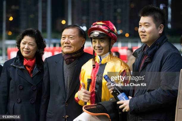 Jockey Derek Leung Ka-chun and owners celebrate after Wonderful Chaser winning the Race 2 Mong Kok Handicap at Happy Valley Racecourse on January 31,...
