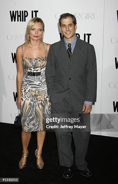 Producer Barry Mendel and guest arrive at the Los Angeles premiere of "Whip It" at the Grauman's Chinese Theatre on September 29, 2009 in Hollywood,...