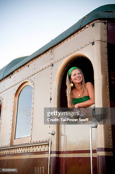 young woman in doorway of napa valley wine train. - napa californië stockfoto's en -beelden
