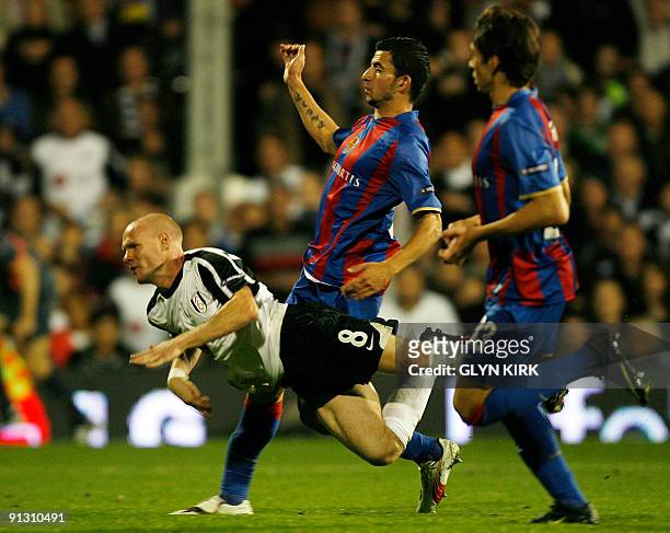 Fulham's English striker Andy Johnson is tripped up in the penalty box during their UEFA Europa League, group E match against Basle at Craven...