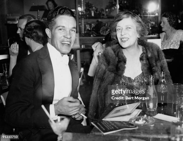 Mr. Robert L. Stevens and Mrs. Nicholas Longworth are shown as they attended the opening of the Metropolitan Opera in New York, 1940. Mr. Stevens is...