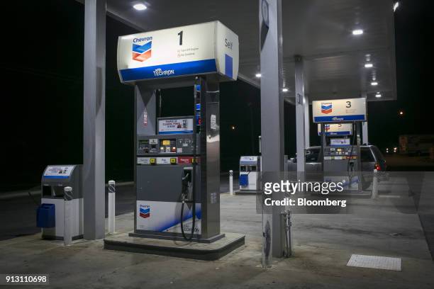 Customer fuels a vehicle at a Chevron Corp. Gas station in Eastanollee, Georgia, U.S., on Monday, Jan. 29, 2018. Chevron Corp. Is scheduled to...