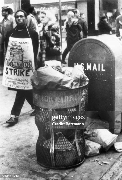 Litter basket filled to overflowing, received a glance from one of about 200 African Americans who marched in downtown Memphis, protesting the city's...