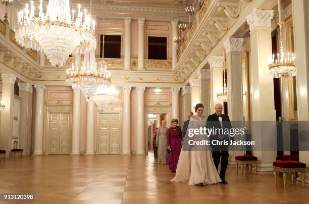 Catherine, Duchess of Cambridge is escorted into dinner by King Harald V of Norway followed by Prince William, Duke of Cambridge ecorted by Queen...