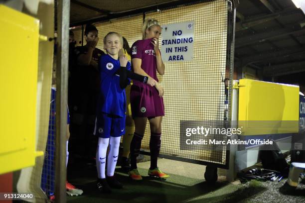 Chelsea mascot pulls a face as Steph Houghton of Manchester City prepares to lead the team out during the WSL match between Chelsea Ladies and...