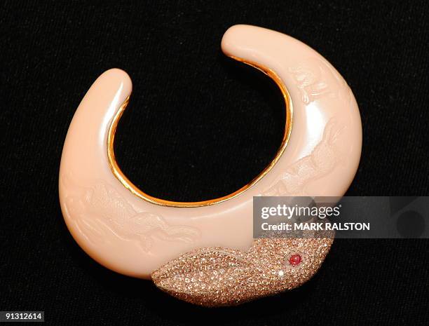 Colored diamond and bakelite "Bunny Bangle" by Daniel Brush that is valued at between USD 40,000 - USD 60,000 is displayed at an auction preview in...