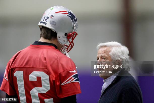 Tom Brady of the New England Patriots talks with Patriots owner Robert Kraft during the New England Patriots practice on February 1, 2018 at Winter...