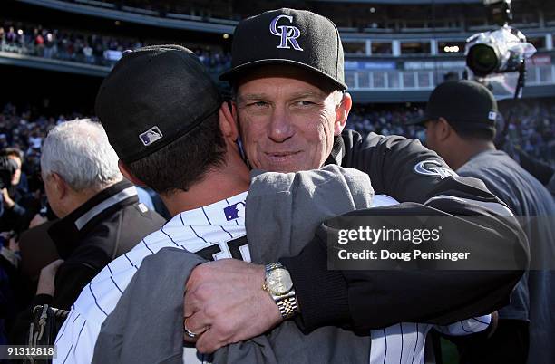 Manager Jim Tracy and closer Huston Street of the Colorado Rockies celebrate after they defeated the Milwaukee Brewers at Coors Field on October 1,...