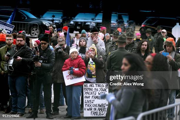 Demonstrators stage a protest at the entrance of the Greenbrier resort where U.S. President Donald Trump addresses the 2018 House & Senate Republican...