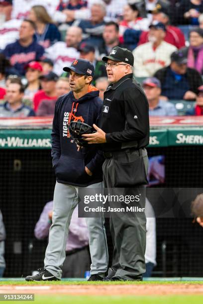 Manager Brad Ausmus of the Detroit Tigers talks to home plate umpire Paul Emmel between innings against the Cleveland Indians at Progressive Field on...