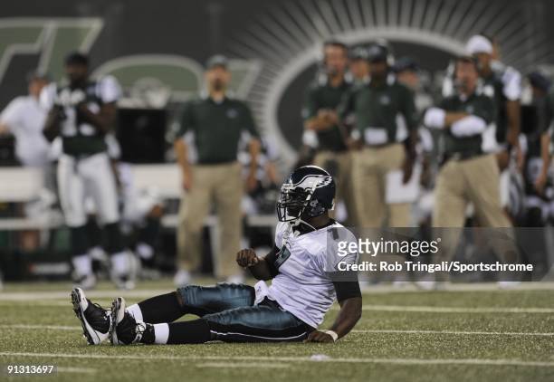 Michael Vick of the Philadelphia Eagles is tackled by the New York Jets on September 3, 2009 at Giants Stadium in East Rutherford, New Jersey. The...