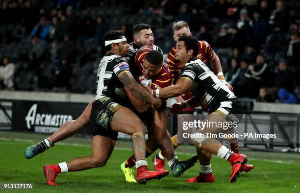 Hull FC's Bureta Faraimo and Albert Kelly tackle Huddersfield Giants' Jordan Turner during the Betfred Super League match at the KCOM Stadium, Hull.