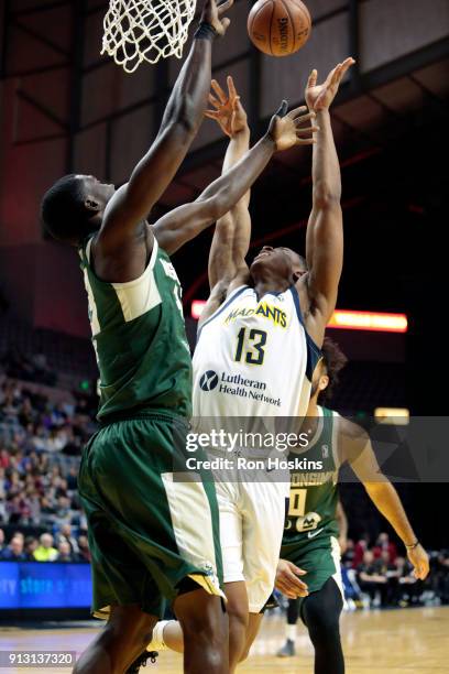 Ike Anigbogu of the Fort Wayne Mad Ants grabs the rebound against Wisconsin Herd defender on February 1, 2018 at Memorial Coliseum in Fort Wayne,...