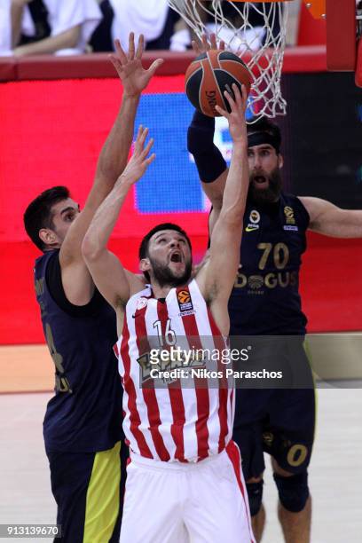 Kostas Papanikolaou, #16 of Olympiacos Piraeus competes with Luigi Datome, #70 of Fenerbahce Dogus Istanbul during the 2017/2018 Turkish Airlines...