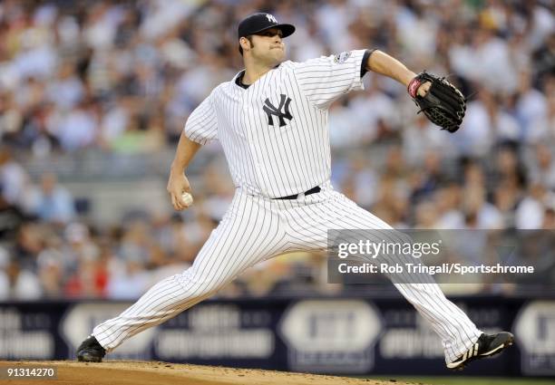 Joba Chamberlain of the New York Yankees pitches against the Boston Red Sox at Yankee Stadium on August 6, 2009 in the Bronx borough of New York...