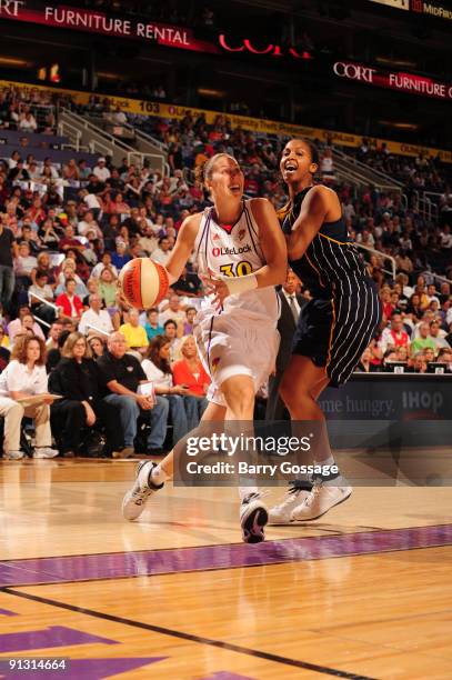 Nicole Ohlde of the Phoenix Mercury drives against Tamika Catchings of the Indiana Fever in Game Two of the WNBA Finals on October 1, 2009 at U.S....