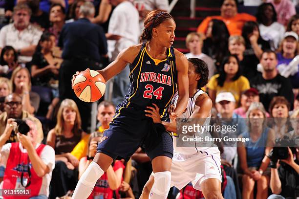 Tamika Catchings of the Indiana Fever is guarded by Temeka Johnson of the Phoenix Mercury in Game Two of the WNBA Finals on October 1, 2009 at U.S....