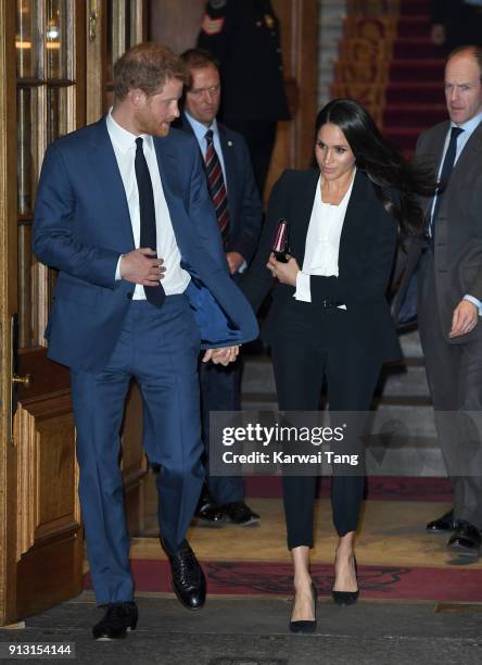 Prince Harry and fiancee Meghan Markle depart after attending the 'Endeavour Fund Awards' Ceremony at Goldsmiths' Hall on February 1, 2018 in London,...