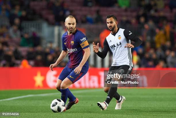 Andres Iniesta of FC Barcelona and Martin Montoya of Valencia CF during the spanish Copa del Rey semi-final, first leg match between FC Barcelona and...