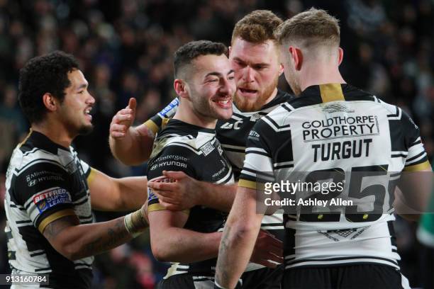Hull FC's Mark Minichiello celebrates with team mates after scoring a Try during the BetFred Super League match between Hull FC and Huddersfield...