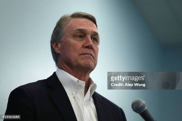 Sen. David Perdue listens during a news briefing at the 2018 House & Senate Republican Member Conference February 1, 2018 at the Greenbrier resort in...