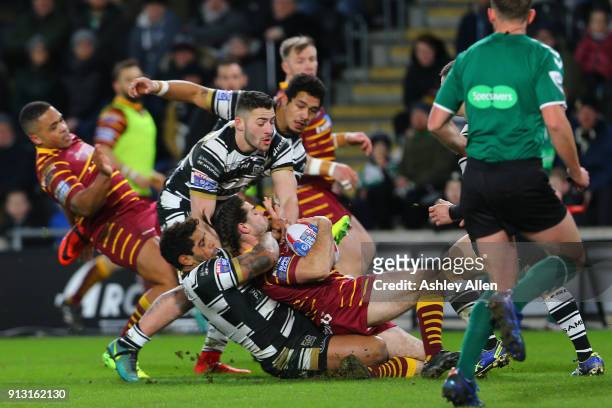 Hull FC Albert Kelly drags down Jake Mamo of Huddersfield Giants during the BetFred Super League match between Hull FC and Huddersfield Giants at...