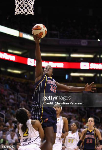 Ebony Hoffman of the Indiana Fever lays up a shot over Temeka Johnson of the Phoenix Mercury in Game Two of the 2009 WNBA Finals at US Airways Center...