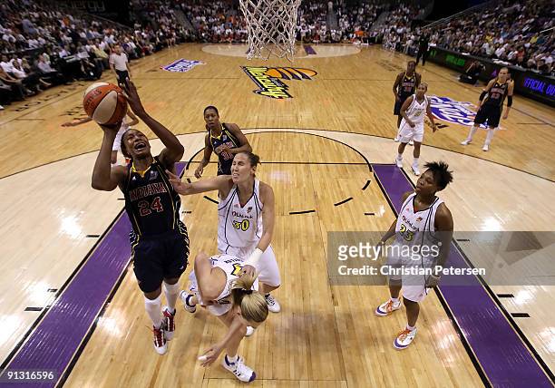 Tamika Catchings of the Indiana Fever lays up a shot past Nicole Ohlde of the Phoenix Mercury in Game Two of the 2009 WNBA Finals at US Airways...