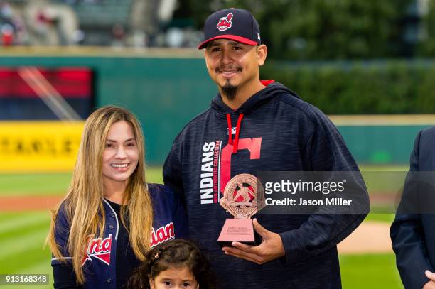 Pitcher Carlos Carrasco of the Cleveland Indians receives the Roberto Clemente award prior to the game against the Baltimore Orioles at Progressive...