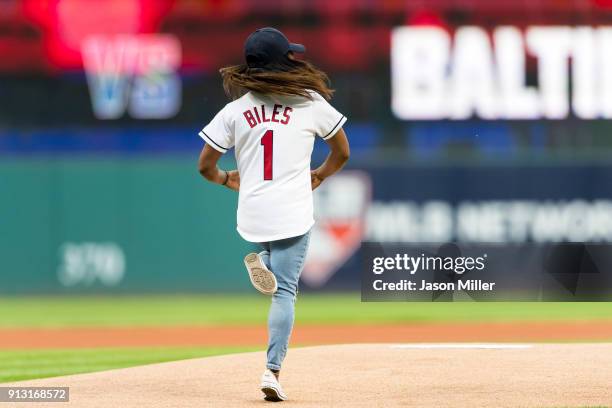 Olympic Gymnast Simone Biles throws out the first pitch prior to the game between the Cleveland Indians and the Baltimore Orioles at Progressive...