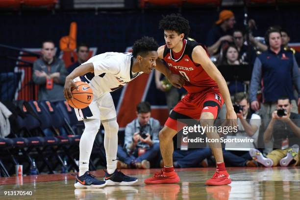 Rutgers Scarlet Knights Guard Geo Baker works against Illinois Fighting Illini Guard Trent Frazier during the Big Ten Conference college basketball...