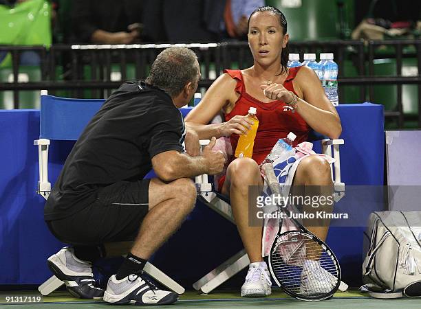 Jelena Jankovic of Serbia talks to her coach in her match against Na Li of China during day six of the Toray Pan Pacific Open Tennis tournament at...