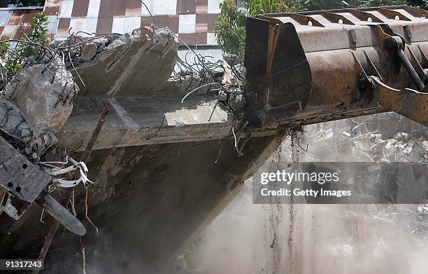 Indonesian Navy workers remove debris from the Gama English Course building site on October 2, 2009 in Padang, West Sumatera, Indonesia. According to...