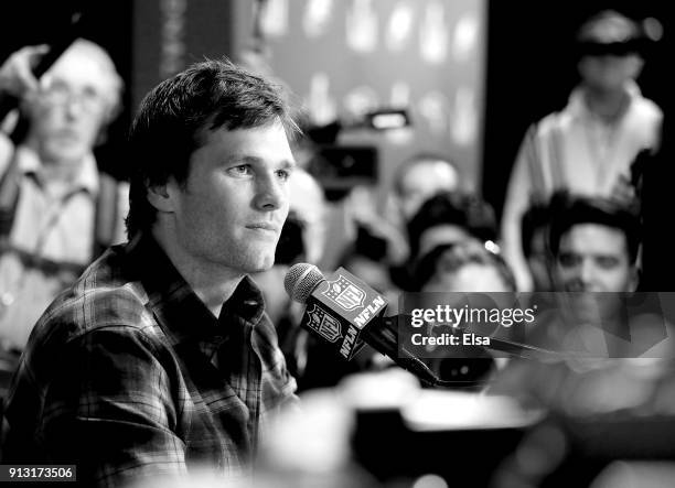 Tom Brady of the New England Patriots speaks to the press during the New England Patriots Media Availability for Super Bowl LII at the Mall of...