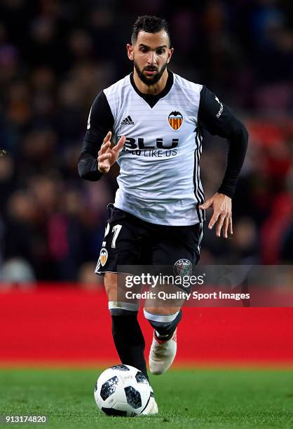 Martin Montoya of Valencia runs with the ball during the Copa del Rey semi-final first leg match between FC Barcelona and Valencia CF at Camp Nou on...