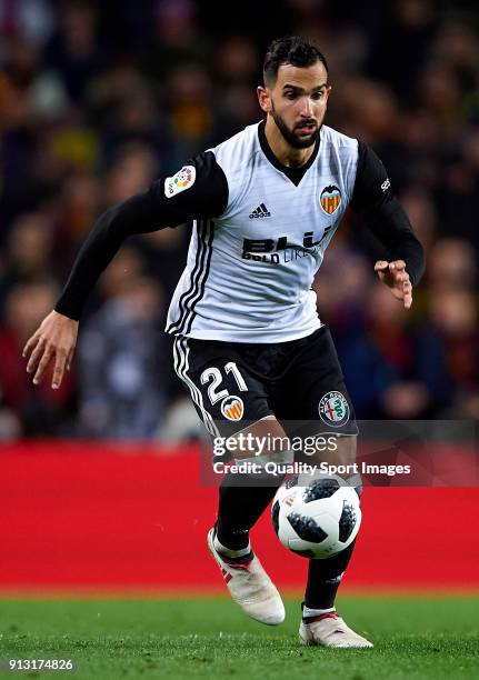 Martin Montoya of Valencia runs with the ball during the Copa del Rey semi-final first leg match between FC Barcelona and Valencia CF at Camp Nou on...