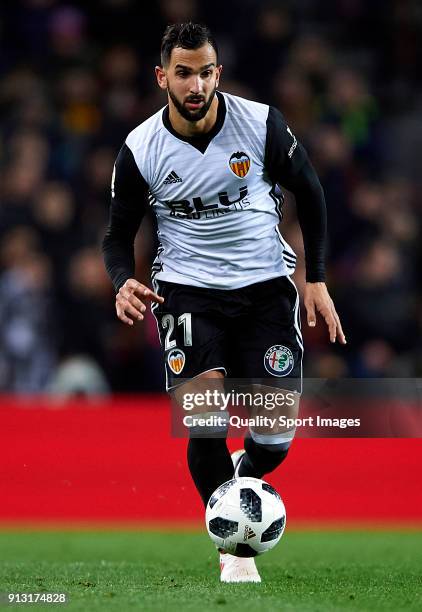 Martin Montoya of Valencia runs with the ball during the Copa del Rey semi-final first leg match between FC Barcelona and Valencia CF at Camp Nou on...