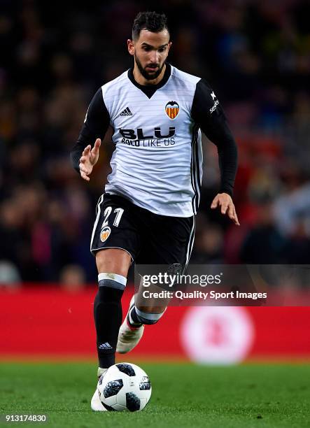 Martin Montoya of Valencia runs with the ball during the Copa del Rey semi-final first leg match between FC Barcelona and Valencia CF at Camp Nou on...