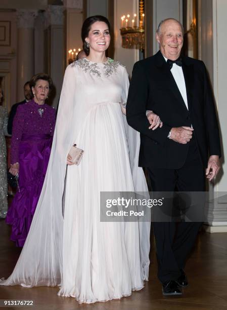 Catherine, Duchess of Cambridge and King Harald V of Norway attend dinner at the Royal Palace on day 3 of their visit to Sweden and Norway on...